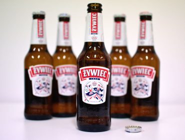 A group of brown bottles with white label.